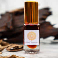 Black Mountain - Handcrafted pure organic attar perfume oil: A blend of hemp & Oud oils.